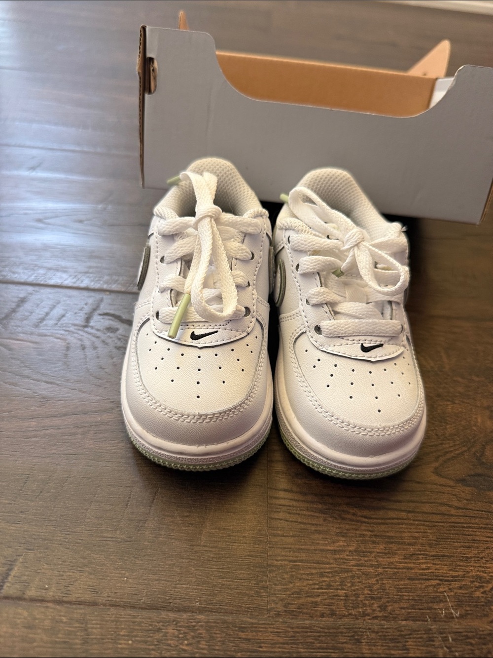Nike Kids White Low-Top Sneakers with Subtle Black Swoosh